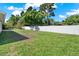 Expansive backyard with lush green grass and a privacy fence, perfect for outdoor activities and relaxation at 5210 Poinsetta Ave, Winter Park, FL 32792