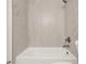 Bathroom featuring a soaking tub with tiled walls and new fixtures at 5210 Poinsetta Ave, Winter Park, FL 32792