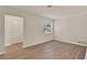 Cozy bedroom featuring wood-look flooring, neutral paint, and a closet at 5210 Poinsetta Ave, Winter Park, FL 32792
