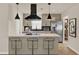 Renovated kitchen with stainless steel appliances, black backsplash, and seating at the island at 5210 Poinsetta Ave, Winter Park, FL 32792