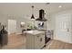Open-concept kitchen with island and stainless steel range at 5210 Poinsetta Ave, Winter Park, FL 32792
