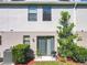 Exterior with a grassy backyard, small patio with grill, and sliding glass door at 5420 Windsor Lake Cir, Sanford, FL 32773