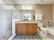 Bathroom with double sink vanity, granite countertop, glass-enclosed shower, and separate tub at 5420 Windsor Lake Cir, Sanford, FL 32773