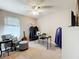 Bedroom with a sewing station, guitars, seating area and neutral colors at 5420 Windsor Lake Cir, Sanford, FL 32773