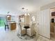 Comfortable dining space with glass table and chairs, open to the kitchen, great for Gathering meals at 5420 Windsor Lake Cir, Sanford, FL 32773