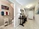 Entryway boasting a console table, a view of a half bathroom, and a white front door at 5420 Windsor Lake Cir, Sanford, FL 32773