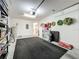 This garage has storage units, seasonal decor, and black mats to protect the floors at 5420 Windsor Lake Cir, Sanford, FL 32773