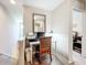 Landing home office space with desk, mirror and chair at 5420 Windsor Lake Cir, Sanford, FL 32773