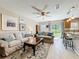 Open-concept living area with comfortable seating and easy access to the kitchen and dining area at 5420 Windsor Lake Cir, Sanford, FL 32773