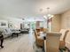 Open-concept living area with a ceiling fan, comfortable seating, and easy access to the kitchen and dining area at 5420 Windsor Lake Cir, Sanford, FL 32773