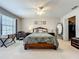 Bright main bedroom with a comfortable sitting area and closet at 5420 Windsor Lake Cir, Sanford, FL 32773