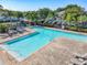 Large community pool with lounge chairs, playground, clear blue water, and nearby parking at 5420 Windsor Lake Cir, Sanford, FL 32773