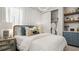 Beautifully decorated bedroom with a plush bed, abundant natural light, and a walk-in closet for ample storage at 570 Hammock Oaks Blvd, Lady Lake, FL 32159