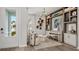 Stylish living room featuring an array of decor, and an open concept to a dining area with ample natural light at 570 Hammock Oaks Blvd, Lady Lake, FL 32159
