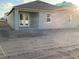 Rear view showcasing the exterior of the house with ample yard space at 5706 Cattle Ranch Drive, St Cloud, FL 34771
