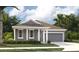 Beautiful one-story home featuring a two-car garage, neutral paint and a well-manicured lawn at 5706 Cattle Ranch Drive, St Cloud, FL 34771