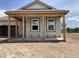This new home features an unfinished porch, and an open yard at 5706 Cattle Ranch Drive, St Cloud, FL 34771