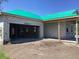 View of new construction with a green roof and block construction with unfinished garage at 5706 Cattle Ranch Drive, St Cloud, FL 34771