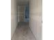 Long hallway with smooth concrete flooring in a new construction home at 5706 Cattle Ranch Drive, St Cloud, FL 34771