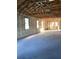 Interior view of block construction with concrete floors and exposed beams, ready for customization at 5706 Cattle Ranch Drive, St Cloud, FL 34771