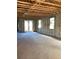Spacious interior view of block construction with concrete floors and exposed beams, ready for customization at 5706 Cattle Ranch Drive, St Cloud, FL 34771