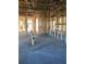 Framing in this open-concept home shows the natural light and open floor plan during construction at 5706 Cattle Ranch Drive, St Cloud, FL 34771