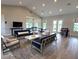 Spacious lounge area with comfortable seating, a games area and lots of natural light at 5706 Cattle Ranch Drive, St Cloud, FL 34771