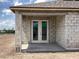 A covered patio with an entrance door at 5706 Cattle Ranch Drive, St Cloud, FL 34771