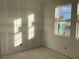 Unfinished room featuring a window with ample natural light at 5706 Cattle Ranch Drive, St Cloud, FL 34771