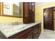 Bathroom featuring a marble countertop, and dark wood cabinetry at 645 Peachwood Dr, Altamonte Springs, FL 32714