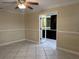 Bedroom with paneled walls and view into ensuite bathroom at 645 Peachwood Dr, Altamonte Springs, FL 32714
