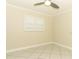 Bright bedroom with white tile flooring and a window with shutters at 645 Peachwood Dr, Altamonte Springs, FL 32714