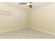 This bedroom features tile floors, crown molding, and a window with shutter-style blinds at 645 Peachwood Dr, Altamonte Springs, FL 32714