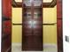 Walk-in closet with dark wood cabinetry and shelves, and tile flooring at 645 Peachwood Dr, Altamonte Springs, FL 32714