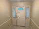 Front door entryway featuring sidelight windows and neutral paint at 645 Peachwood Dr, Altamonte Springs, FL 32714