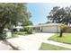 Beautiful, single-story home with a two car garage, well-maintained lawn, and lush landscaping at 645 Peachwood Dr, Altamonte Springs, FL 32714