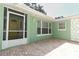 Welcoming front porch with brick flooring and a bright yellow front door at 645 Peachwood Dr, Altamonte Springs, FL 32714