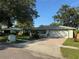 Charming single-story home with a well-manicured lawn, mature trees, and inviting curb appeal at 645 Peachwood Dr, Altamonte Springs, FL 32714
