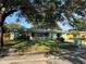 Charming single-story home with a well-manicured lawn, mature trees, and a quaint mailbox at 645 Peachwood Dr, Altamonte Springs, FL 32714