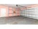 This garage provides ample storage space, with shelving and easy access through a door at 645 Peachwood Dr, Altamonte Springs, FL 32714
