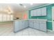 Spacious kitchen with tile flooring, stylish cabinetry, modern countertops, and an open layout at 645 Peachwood Dr, Altamonte Springs, FL 32714