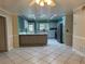 Open kitchen view featuring a large island and stainless steel appliances at 645 Peachwood Dr, Altamonte Springs, FL 32714