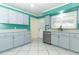 Well-lit kitchen with modern stainless steel appliances, sleek countertops and clean cabinetry at 645 Peachwood Dr, Altamonte Springs, FL 32714