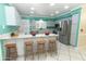 Bright kitchen boasts a breakfast bar, stainless steel appliances, and ample countertop space for food preparation at 645 Peachwood Dr, Altamonte Springs, FL 32714