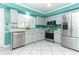Bright kitchen featuring stainless steel appliances, light cabinetry, and modern finishes at 645 Peachwood Dr, Altamonte Springs, FL 32714