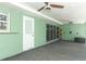 View of the lanai with white door and sliding glass doors, perfect for enjoying the outdoors at 645 Peachwood Dr, Altamonte Springs, FL 32714