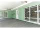 Spacious lanai with sliding glass doors and ceiling fans offering easy access to the backyard at 645 Peachwood Dr, Altamonte Springs, FL 32714