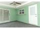 Enclosed lanai with sliding glass doors and ceiling fan for outdoor relaxation at 645 Peachwood Dr, Altamonte Springs, FL 32714