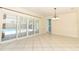 Open living room showcasing tile flooring, a modern ceiling fan, and sliding glass doors at 645 Peachwood Dr, Altamonte Springs, FL 32714
