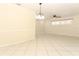 Open living room with tile flooring, modern ceiling fan and window with shutters at 645 Peachwood Dr, Altamonte Springs, FL 32714